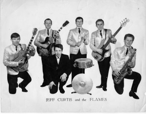 Left to right: Louis McKelvey (lead guitar); Keith Gardiner (rhythm guitar), Jeff Curtis (lead vocals); Malcolm Tomlinson (drums); Dave Wiggington (bass) and Malcolm Tagg-Randall (saxophone)