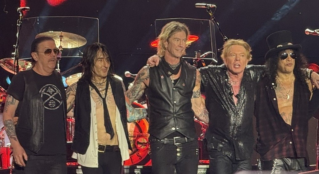 Guns N' Roses at Usce Park, Belgrade in 2025. From left to right: Dizzy Reed, Richard Fortus, Duff McKagan, Axl Rose, Slash, By AxeAdam20 - Own work, CC0, https://commons.wikimedia.org/w/index.php?curid=171742573