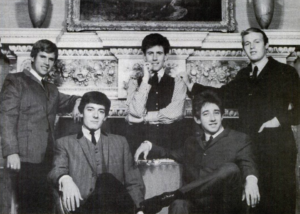 Trade ad for The Hollies's single "I'm Alive" (from left to right: Eric Haydock, Allan Clarke, Graham Nash, Tony Hicks and Bobby Elliott).