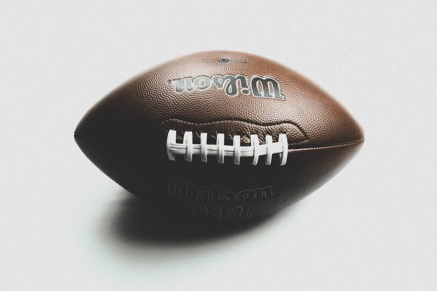 Close-up of a Wilson NFL football against a white backdrop (Dhia Eddine, Pexels, free)